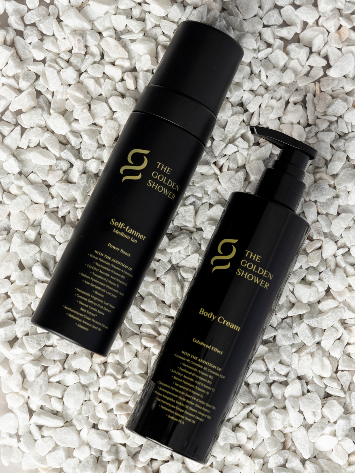 Golden Shower Beauty Enhanced Effect body cream on white stones - self tan and skincare kit styling shot